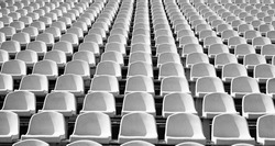 seats of tribune on sport stadium. empty outdoor arena. concept of fans. chairs for audience. cultural environment concept. color and symmetry. empty seats. modern stadium. yellow tribunes