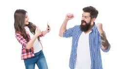 Happy girl daughter show thumbs up and take photo of euphoric man father making winning gesture isolated on white, winner