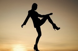 Get up and get moving. Dance girl. Girl silhouette on evening sky. Female performer