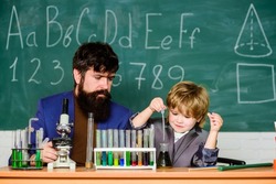 Genius kid. Joys and challenges raising gifted child. Teacher bearded scientist man child test tubes. Chemical experiment. Genius child private lesson. Knowledge day. Genius minds. Special and unique