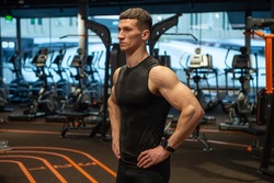 muscular athlete in fitness gym. muscular athlete in sport gym. sport and fitness. muscular athlete