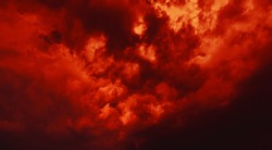 Nature background. Dramatic clouds on the sky in red colors