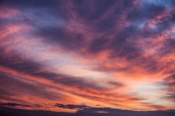 Abstract nature background. Dramatic and moody pink, purple and blue cloudy sunset sky