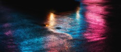 Abstract urban background. Lights and shadows of New York City. NYC streets after rain with reflections on wet asphalt. 