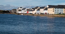 Row of colorful houses at the Long Walk, Galway, Ireland.