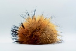 Fluffy lump, fluff in the center of the frame, fur toy, fluffy red fur, place for text, unusual background, piece of fur, fox fur 