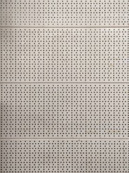 Metal texture with holes, the back wall of the rack in the market, the platform for attaching shelves in the supermarket, painted metal with holes, a pattern of holes. 