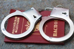handcuffs are on the passport of the Russian Federation. punishment in Russia. High quality photo