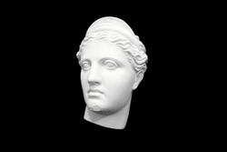 bust head of a woman made of plaster cast isolated on black background. three-quarter position. High quality photo