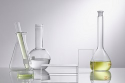 Empty podium glass for cosmetic bottle containers. Research and develop beauty skincare product concept with scientific glassware. Concept laboratory tests and research natural extract making cosmetic