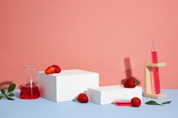 Pink Background for Biologica strawberry extract and leaves and white podium in biological test tubes. Production of cosmetics based on strawberry. Blank space for advertising