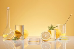 Background for  Biological experiment presentation lemon extract and rosemary leaves and yellow water in biological test tubes. Production of cosmetics based on Citrus
