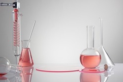 Scientist with chemical reaction in chemistry laboratory. close up of scientist making research in lab in white background , red water in test tube and blank space for advertising , front view