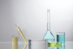 Front view of laboratory equipment filled with colorful fluid in a beaker test tube in lab background for experiment advertising 