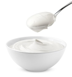 sour cream in bowl and spoon, mayonnaise, yogurt, isolated on white background, clipping path, full depth of field