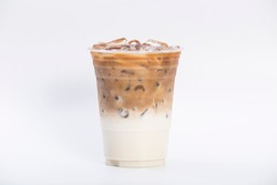 cold brewed iced latte coffee, showing separate in a layer the bottom as milk top by coffee shot in a plastic glass 16oz. isolated white background