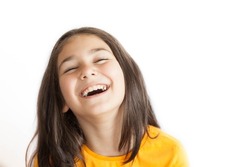 Portrait of happy smiling kid girl in yellow T-shirt isolated on white background