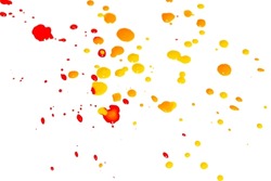 Spots of yellow and red paint on a white background. Splashes of paint colored on white. Drops of paint on a white canvas.
