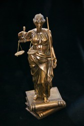 Statue of Themis, Law Courts. blindfold Lady Justice Old small Statue in bronze. Law Courts Goddess of justice figure bronze on black background. Antique bronze culture concept. small statue bronze 