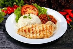 Rice beans grilled chicken steak salad and farofa