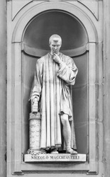 Statue of Niccolo Machiavelli in the niches of the Uffizi Gallery colonnade, Florence.
