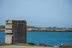 Remains of old military installations on the island of Guernsey in the Channel Islands, with the scars of war visible in the stone.