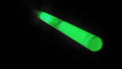 Close up shot of green glowstick at night