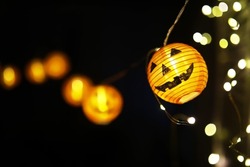 The concept of light on the night Halloween.Round lamp shape of pumpkin used to decorate with copy space for text.