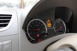 a series of numbers and warning symbols indicating the speed on the car's speedometer