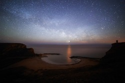 Ultra wide angle view of the Milky way , rising from Bolata , Bulgaria