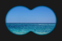 Sea view through binoculars. Seascape view via the field-glass. 
