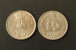 Closeup of both sides of Twenty Five Paise coins of India,minted in 1982 to commemorate IX Asian Games