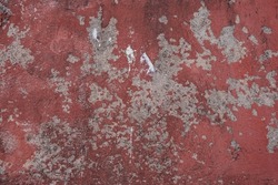 Detail of red worn-out painting at the wall of an old Mexican Hacienda