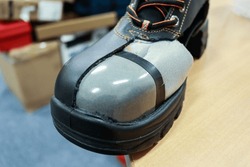 Steel toe cap is a steel plate on the toe of safety shoes to protect the feet from the impact of hard objects