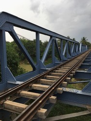 a single track railway bridge on a cloudy day
