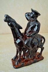Ceramic figurine. Sancho Pans on a donkey.