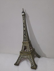 This is a photo of a man made tower which is located in France and is the biggest tower in the world known as Effiel tower
