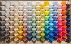 Color palette. Display with colored paint pantones for interior decoration. Multicolored square cube bars painted with paints of all colors