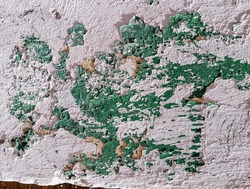 Weathered cement wall with scratched and peeling paint. Abstract aged wall textured background.