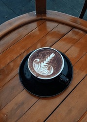 A cup of cappucinno, latte art