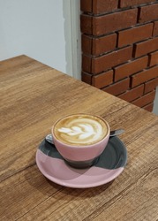 A cup of cappucinno, latte art