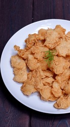 Crispy-fried dori, made from pieces of dory fish wrapped in seasoned flour. Menu. Close up
