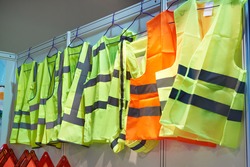 Colored, reflective vests for drivers and road workers