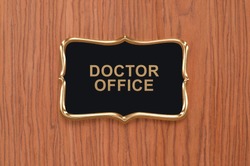 Close up of Doctor Office Sign on wood Door