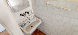 Hungarian hospital's disgusting bathroom - socreal or socialist style obsolete rotten white bathroom with mold, old washbasin and rust