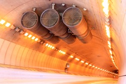 Car Light Trails and Ventilation Fans  inside Caldecott Tunnel. Berkeley Hills, California, USA.