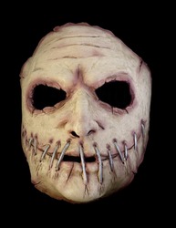 Serial Killer Mask with a Broad Mouth Sewn Shut Isolated Against Black Background