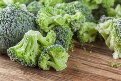Frozen broccoli with ice and healthy food raw ingredient,  cold close-up.