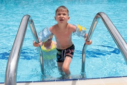 Mother son pool fun family game water. happy smiling