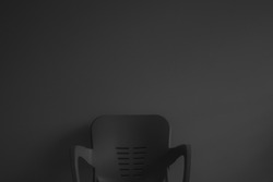 Grey chair on grey dark background monochrome black and white image, chair isolated image, image of plastic garden chair	